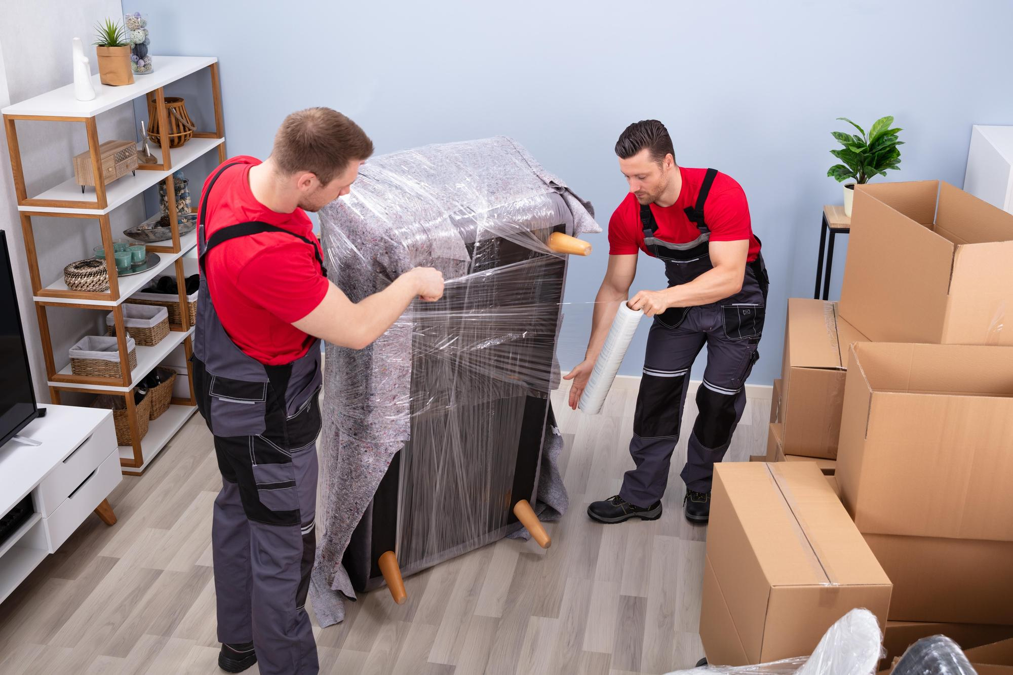 Apartment moving service inner image showing movers carefully handling furniture in apartment – Easy Best Move